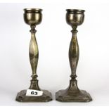 A pair of hallmarked silver candlesticks, H. 21cm.