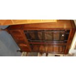 A 1920's ball and claw foot mahogany bookcase, W. 102cm H. 175cm.