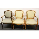 Three upholstered armchairs.