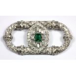 An impressive white metal (tested 18ct gold) emerald and diamond set brooch, 7 x 3.2 cm.