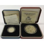 A 1993 silver five pound coin with a 1995 silver proof one pound coin.