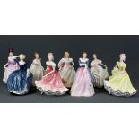 A group of eight Royal Doulton lady figurines.