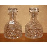 A pair of cut crystal decanters, H. 22cm. One slightly A/F.