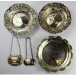 A hallmarked silver coaster, D. 12.5cms. together with two pierced silver baskets (One A/F) and