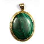 A yellow metal (tested 15ct gold) malachite mourning pendant, L. 5.5cm.