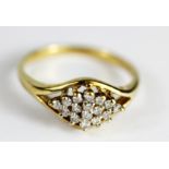 A 9ct yellow gold diamond set cluster ring, (N.5).