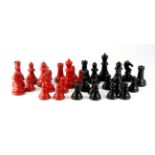 A vintage cast metal chess set, king H. 5cms.