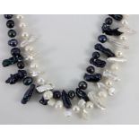 Two black and white pearl and baroque pearl necklaces, L. 44cm.