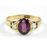 An 18ct yellow gold amethyst and citrine set ring, (stones worn), (L).