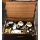 A vintage case of clocks and barometers.