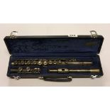 A cased silver plated flute by Buffet.