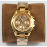 A boxed gentleman's Michael Kors gold plated stainless steel wrist watch, unused.
