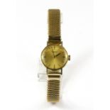 A lady's International Watch Co 9ct yellow gold wrist watch with elasticated strap.