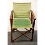 A wood and canvas folding directors chair.