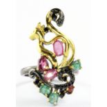 A 925 silver gilt ring set with emerald, ruby and black spinel, (L).