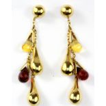 A pair of 18ct yellow gold drop earrings set with briolette cut citrine and garnets, L. 5.5cm.