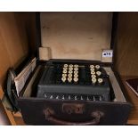 A cased vintage adding machine, case size 31 x 20 x 14cm.