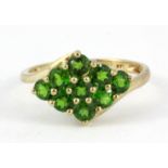 A 9ct yellow gold chrome diopside set cluster ring, (R.5).