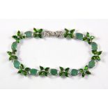 A 925 silver emerald and chrome diopside set bracelet.