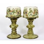 A pair of enamelled olive green glass goblets, H. 15cm.