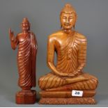 Two carved wooden figures of the Buddha, tallest H. 36cm.
