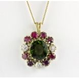 A yellow metal (tested minimum 9ct gold) pendant set with a large oval cut green tourmaline,