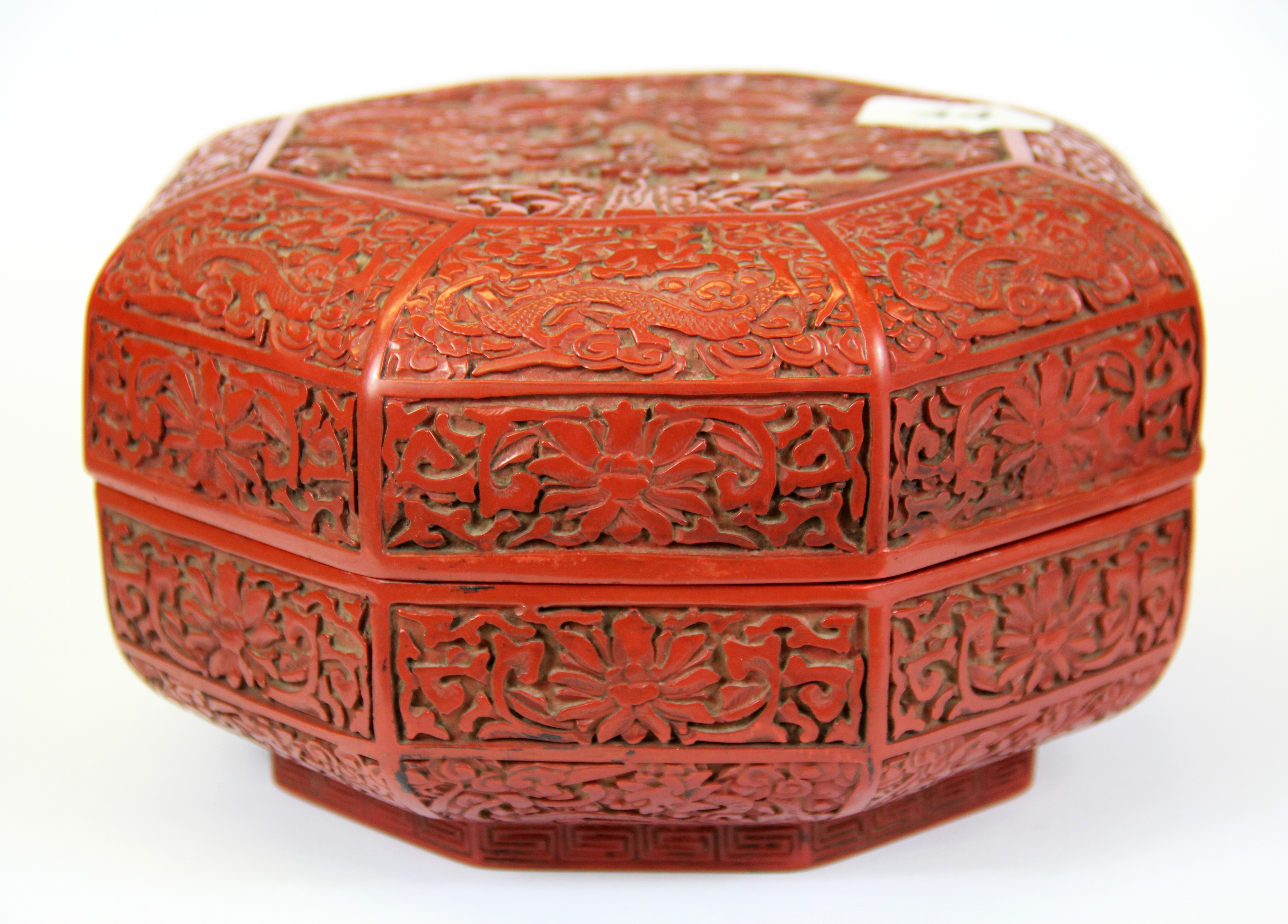 An octagonal Chinese cinnabar lacquer box, 21 x 13cm.
