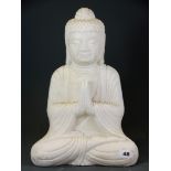 A carved white marble figure of the seated Buddha, H. 38cm.