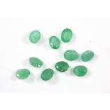 Ten unmounted oval cut emeralds, approx. 3.5ct, 5 x 4mm.