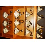 A group of eleven stained glass wall lights and one double wall light, shade Dia. 20cm.