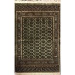 A green ground finely woven Bukhara type rug, 190 x 140cm.