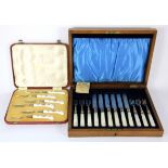 A cased set of mother of pearl handled fruit knives and forks and a cased set of Royal Crown Derby