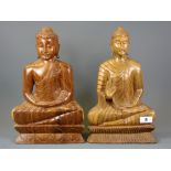 Two carved hardwood figures of the seated Buddha, H. 36cm.