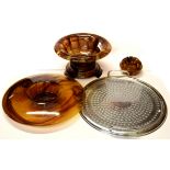 Two brown Davidson glass bowls, one with a chromium tray stand, largest Dia. 33cm.