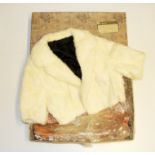 A vintage blonde mink cape in a Harrods box.