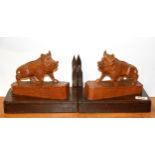 A pair of early 20th Century Black Forest carved wooden wild boar bookends, H. 20cm.