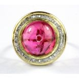 A 14ct yellow gold (stamped 14k) cabochon cut tourmaline and diamond set ring, (Q).