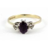 A 9ct yellow gold amethyst and white stone set ring, (K).
