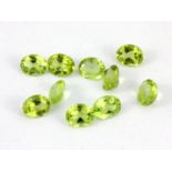 Ten oval cut peridots, approx. 3.75ct, 5 x 4mm.