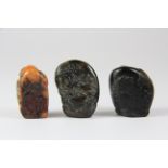 A group of three small Chinese hardstone pebble seals, H. 3.5cm.