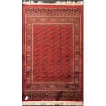 A red ground Bukhara type finely woven rug, 190 x 140cm.