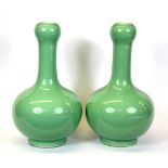 A pair of Chinese celadon glazed porcelain vases, H. 22cm.