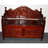 A carved hardwood hall bench/chest, W. 100cm.
