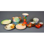 A group of Clarice Cliff and Wilkinson ceramic items.