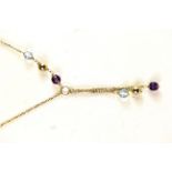 A boxed 18ct yellow gold amethyst and blue topaz set necklace.