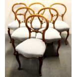 A set of six upholstered 19th century mahogany balloon back chairs.