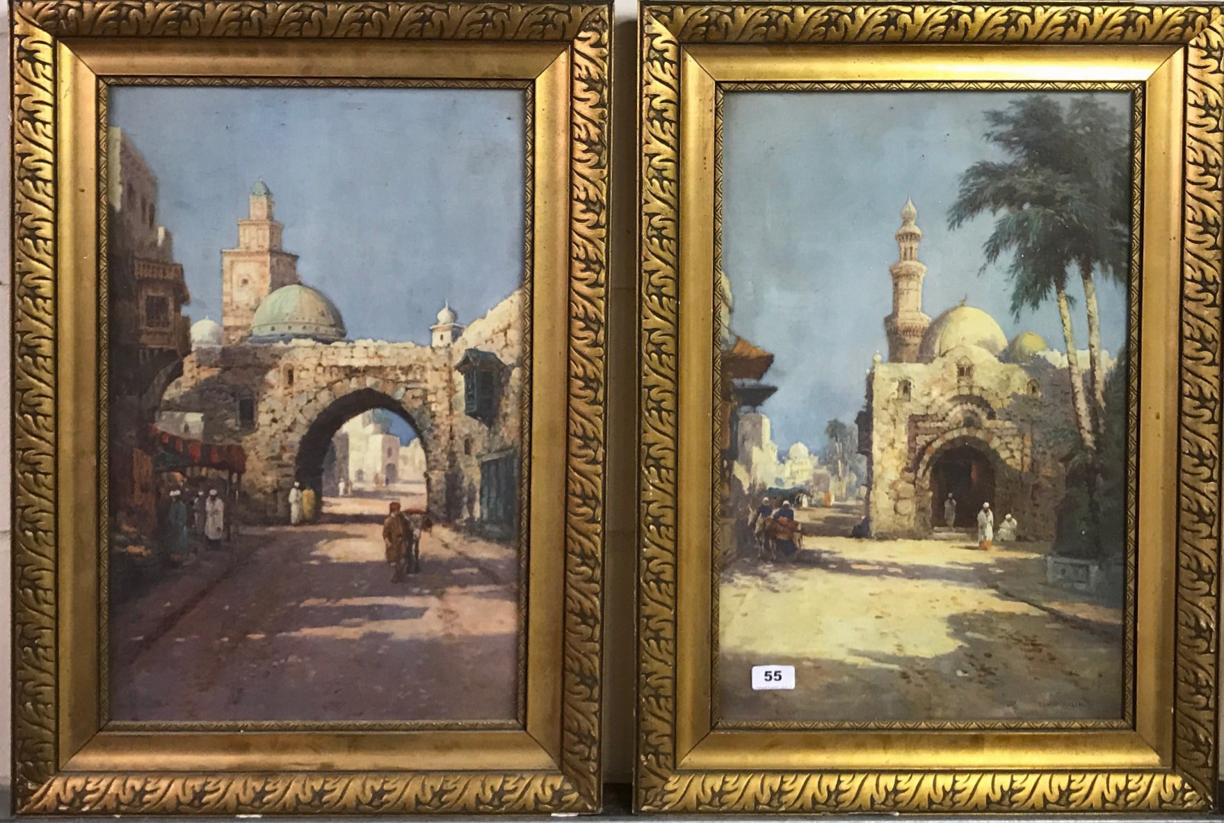 A pair of gilt framed 1920's lithographs of Arab scenes by David Malcom, framed size: 52 x 72cm.