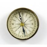 A vintage brass pocket compass, Dia. 3.5cm.