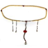 A long strand of Tibetan gilt glass, agate and rock crystal prayer beads, folded L. 120cm. In a silk