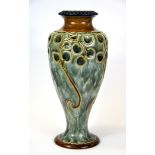 An Art Nouveau Royal Doulton stoneware vase, H. 28cm. Small repair to base.